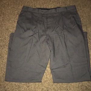 Oscar De La Renta gray trousers.